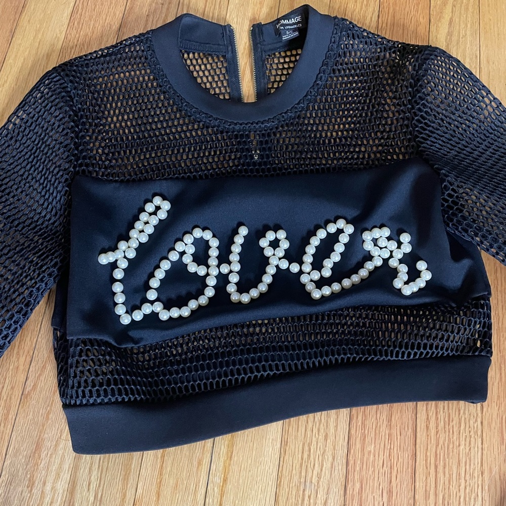 Black mesh crop top with the word “Lover” in pearls on front.